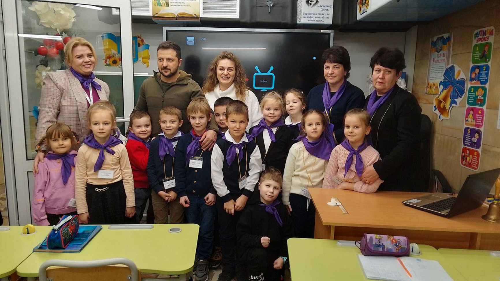 President of Ukraine Volodymyr Zelensky with children during his visit to the subway school.